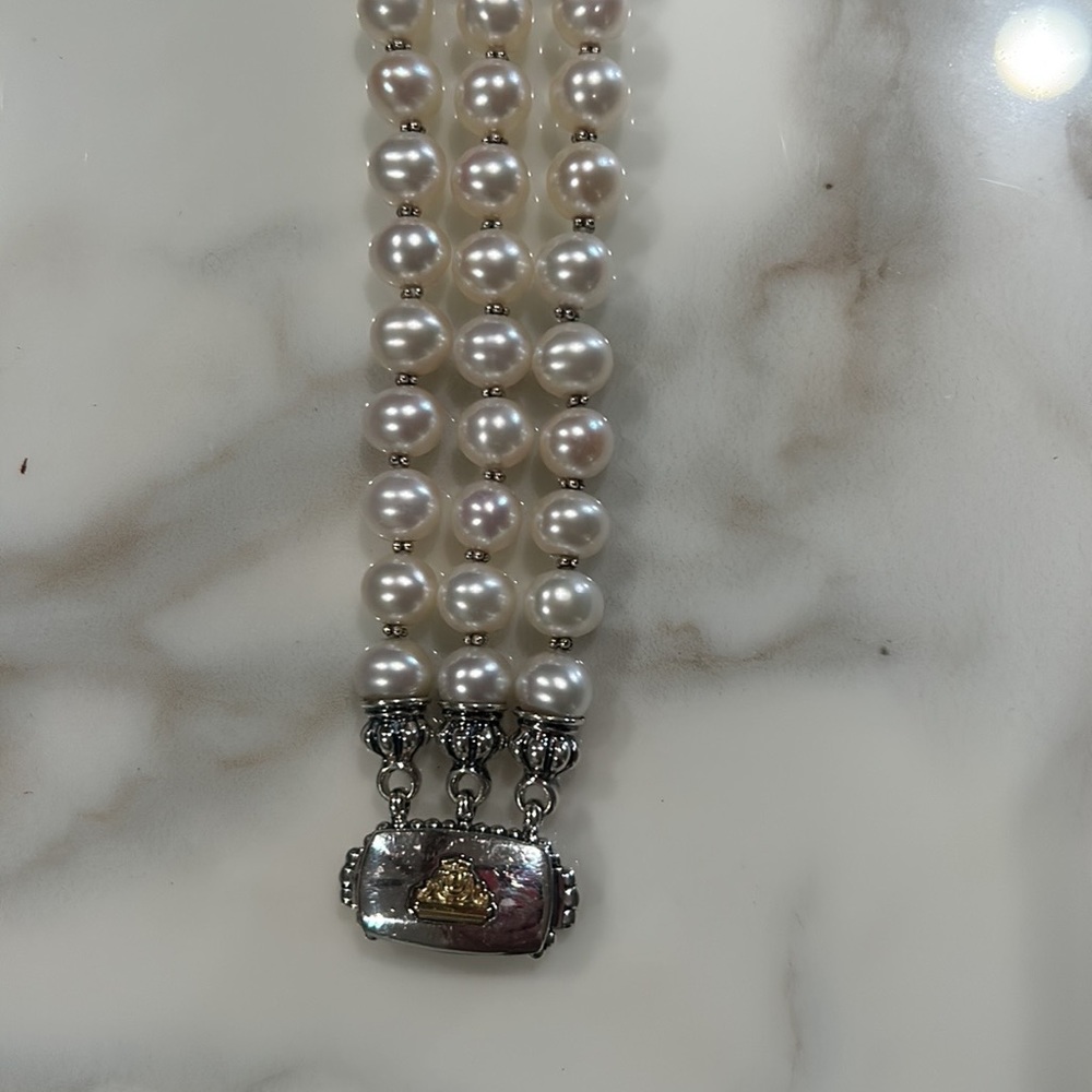 Lagos Triple strand bracelet sterling with 14 c gold on catch.